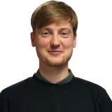 Philipp Henning blondes, kurzes Haar, Hemd und Pullover, ich im Profil